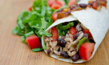 vegan burrito with black beans, rice and veggies