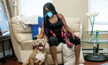 Portrait of Denise Young with her dog Drama.