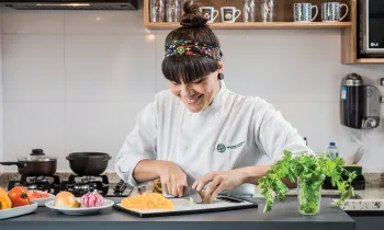 Chef Adriele Carvalho prepares ingredients for her plant-based take on a Brazilian stew.