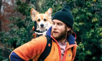 Bryan Reisberg with his corgi, Maxine, strapped into his self-designed backpack.