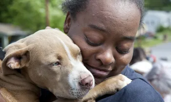 Woman holding a dog