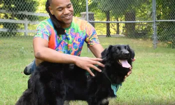 Onyx with his adopter, Lewis Miles.