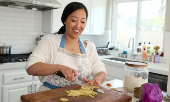 Joanne Molinaro, the Korean Vegan, chops ingredients for a recipe