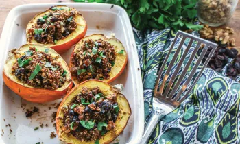 Photo of stuffed acorn squash with herbed quinoa and cranberries