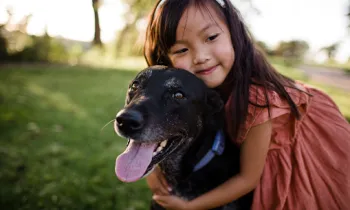 a person holding a dog