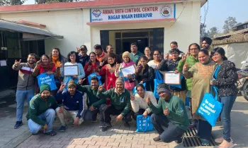 a group of people posing for a photo outside of a building