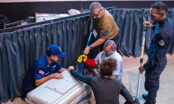 A group of law enforcement agency (LEA) representatives being trained in the use of animal handling tools.