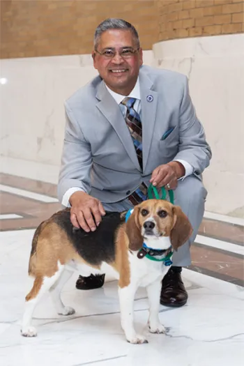 Former Massachusetts state legislator Jose Tosado with Louie, who was previously used in research.