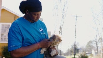 Man holding a dog