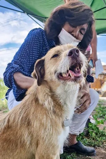 A woman with one of her dogs