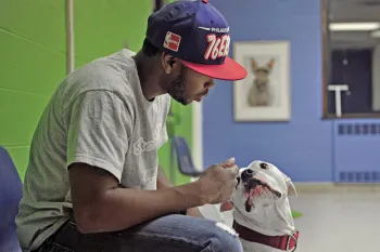 Man sitting with his dog