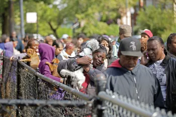 Line of people and their pets at Pets for Life event