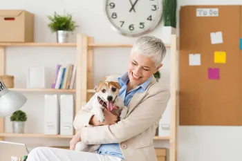 Woman and her dog in the workplace