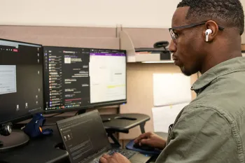 Humane World employee working at his desk