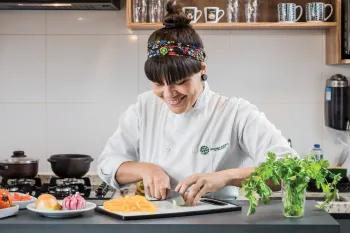 Chef Adriele Carvalho prepares ingredients for her plant-based take on a Brazilian stew.
