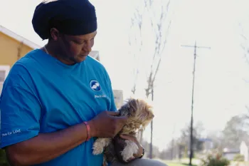 Man holding a dog