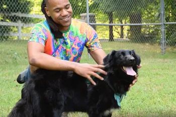 Onyx with his adopter, Lewis Miles.