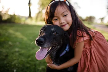 a person holding a dog
