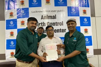a group of men holding a certificate