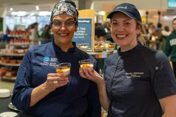 Chef Jen and Chef Tracy serving Thai Tea Tiramisu