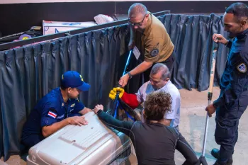 A group of law enforcement agency (LEA) representatives being trained in the use of animal handling tools.