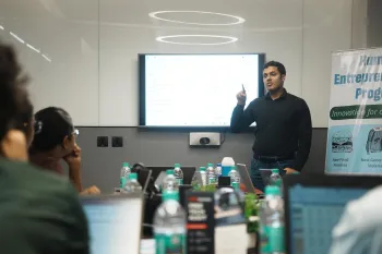 Conference room where a group of people are engaged in a presentation.