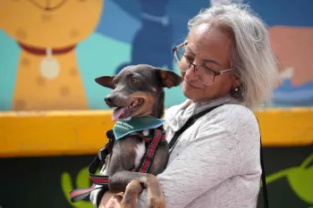 Woman holding dog