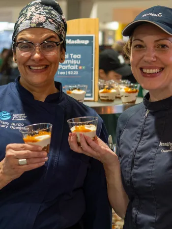 Chef Jen and Chef Tracy serving Thai Tea Tiramisu