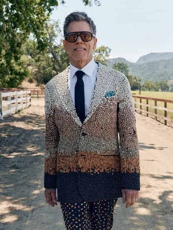 Kevin Bacon wearing a suit made of beans