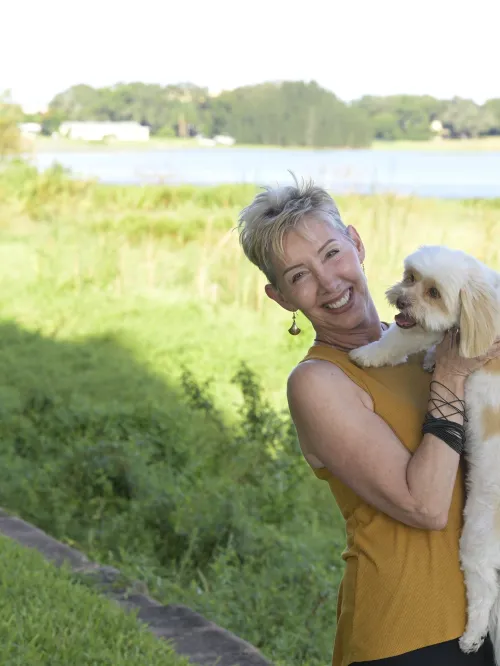 Debra Radford and Buddy pose for a portrait