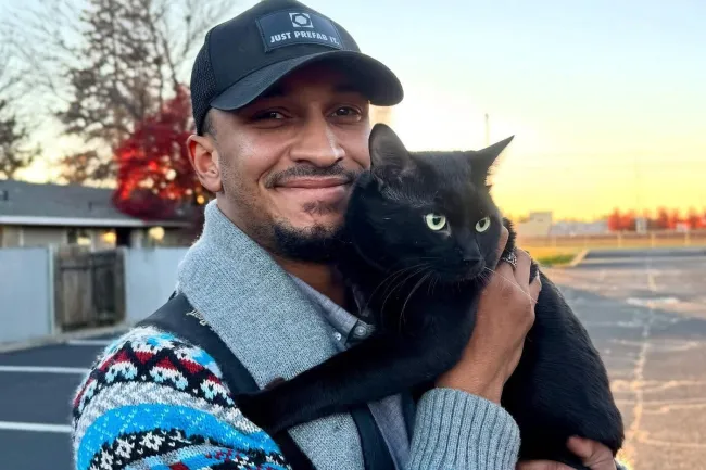 a person holding a cat