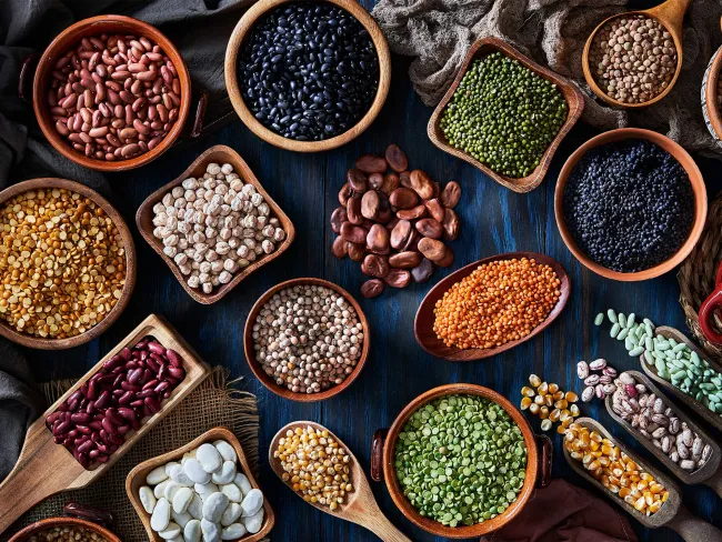 Legumes and beans on a rustic wooden table