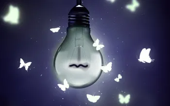 Photo illustration of a dim light bulb with illustrated butterflies