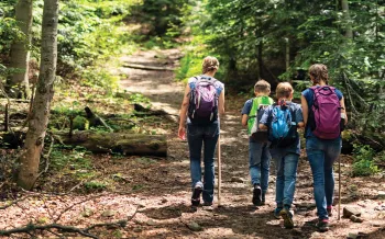 Mother and three kids on a nature walk