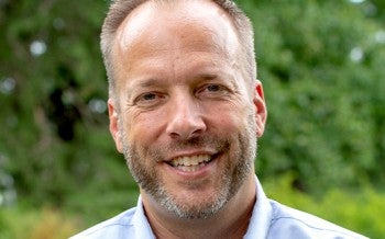 Headshot of a man, Jeff, smiling at the camera