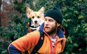 Bryan Reisberg with his corgi, Maxine, strapped into his self-designed backpack.