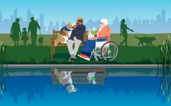 Senior man and woman sitting by a lake with their pets, in the lake reflection the people are missing.
