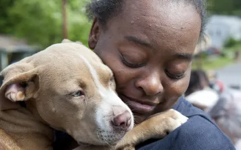 Woman holding a dog