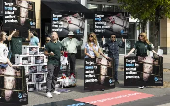 Multiple people protesting with signs