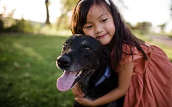 a person holding a dog