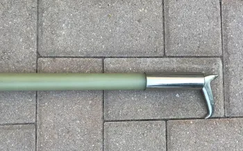 a close up look at a bullhook; a sharp, steel-tipped weapon