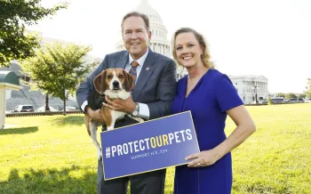 Two people and a dog