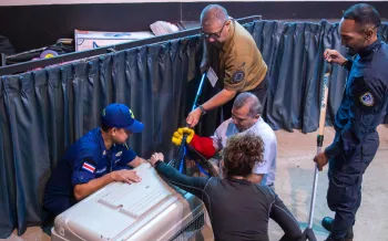 A group of law enforcement agency (LEA) representatives being trained in the use of animal handling tools.