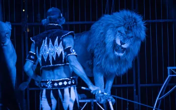 Circus performer with a  large cat
