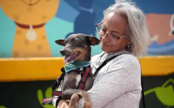 Woman holding dog