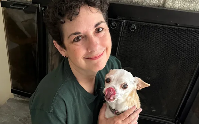 Kathleen Summers, outreach and research director for the Stop Puppy Mills campaign at Humane World for Animals, holding Peanut the dog.