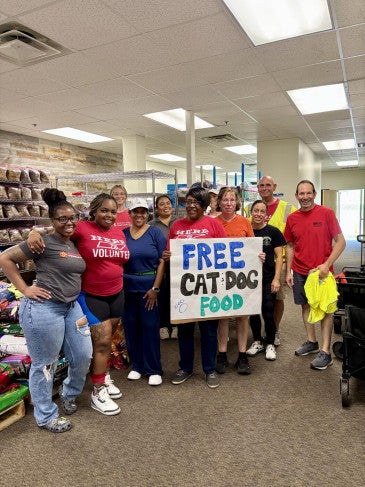 a group of people holding a sign